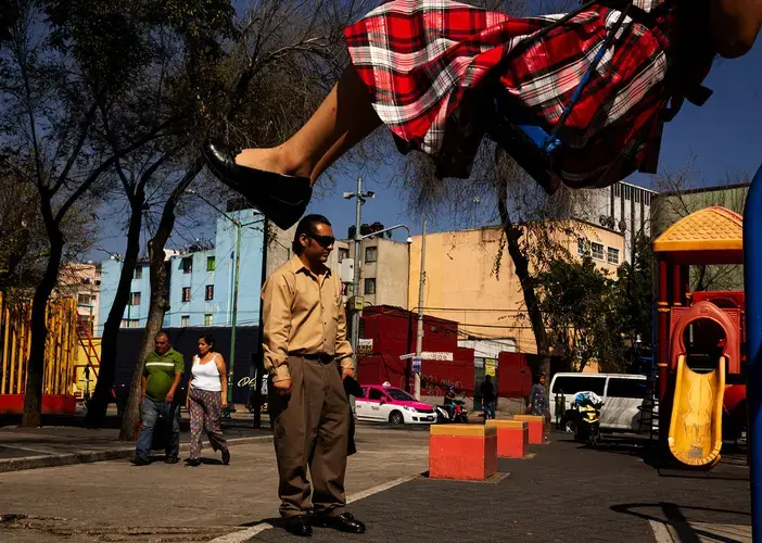 Josue Zarazua plays in the park with his three children in Mexico City. “We came back to a country we don’t know or can’t remember,” he says. “We’re like strangers in our own land, foreigners. That’s a hard mindset to overcome.” Image by Erika Schultz. Mexico, 2019.