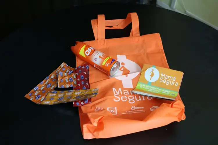 Mama Segura bags were developed by PASMO/PSI and handed out to pregnant women to prevent Zika. They included insect repellent, a pamphlet about Zika, and 10 condoms. Image by Lauryn Claassen. El Salvador, 2017.