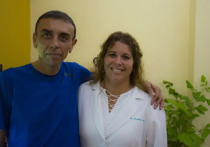 Dr. Anabely Estévez García is pictured with a patient. Image by Desmond Boylan. Cuba, 2017