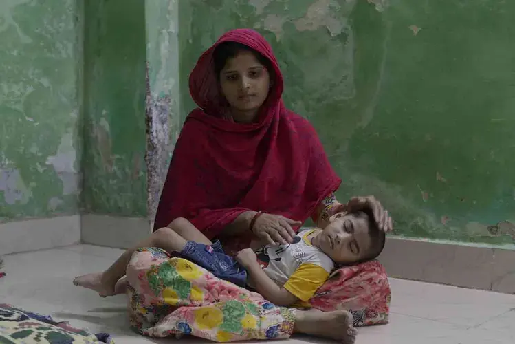 Azaan, 3, with his mother Nagma. Image by by Rohit Jain. India, 2020.