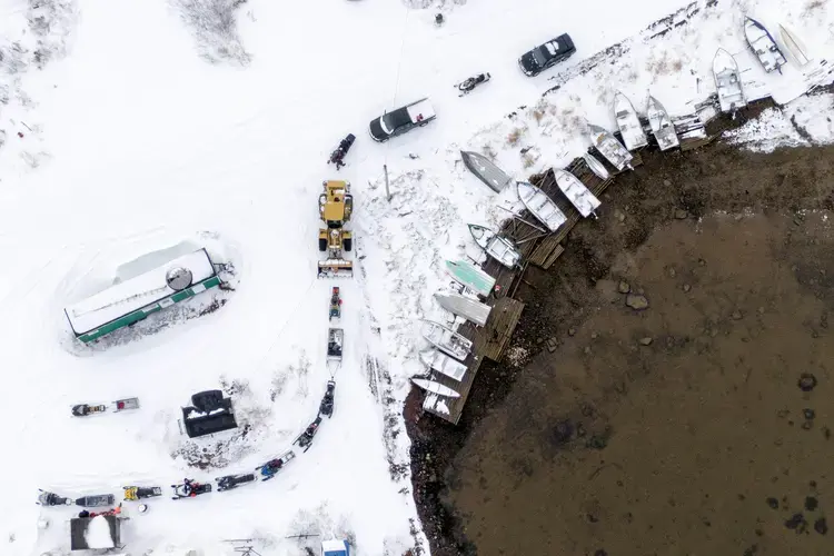 A line for fuel forms at the Rigolet gas station on November 14, 2019. Fuel comes twice a year by tanker ship and the gas station is open every other day for about two hours. Image by Michael G. Seamans. Canada, 2019.