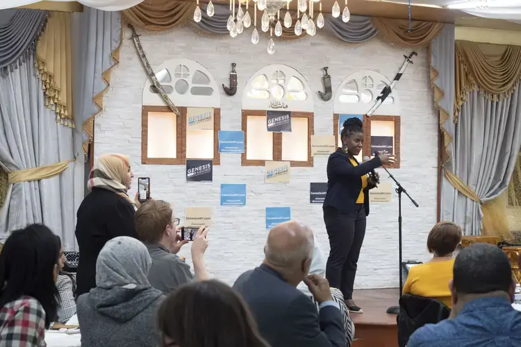 Genesis Aquino speaking in front of the crowd at her campaign launch party. Image by Hana Elias. United States, 2019.