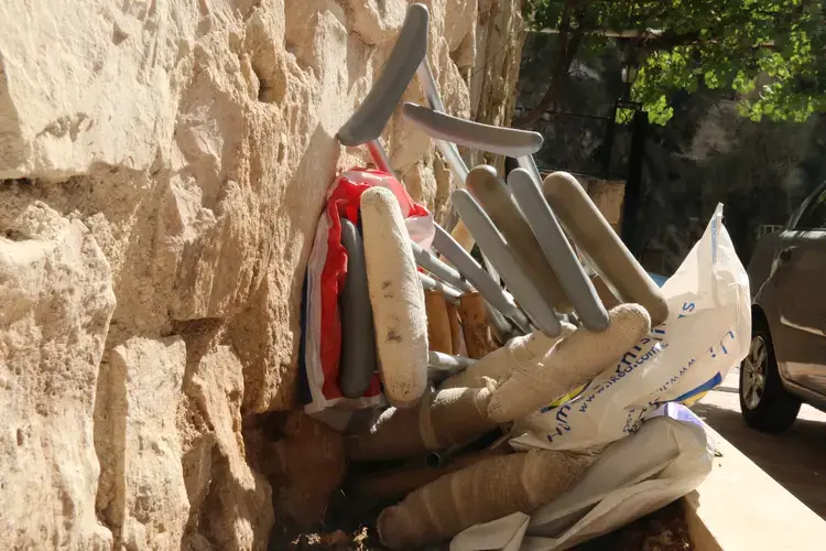 Crutches are set aside outside Souriyat Across Borders, a center for injured Syrian refugees. Residents receive physical therapy, and some receive mental health therapy. Image by Sawsan Morrar. Jordan, 2017.