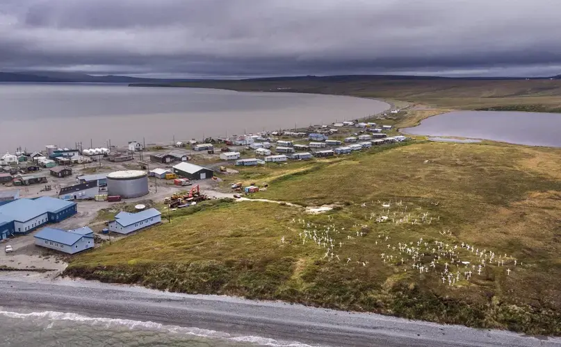 Teller is a Northwest Alaska coastal community born from a gold rush more than a century ago. Now an Inupiaq village, it faces threats from rising seas and stronger winter storms that have been eroding a bluff. On that bluff, the crosses of a cemetery are crooked due to thawing permafrost. Image by Steve Ringman. United States, 2019.