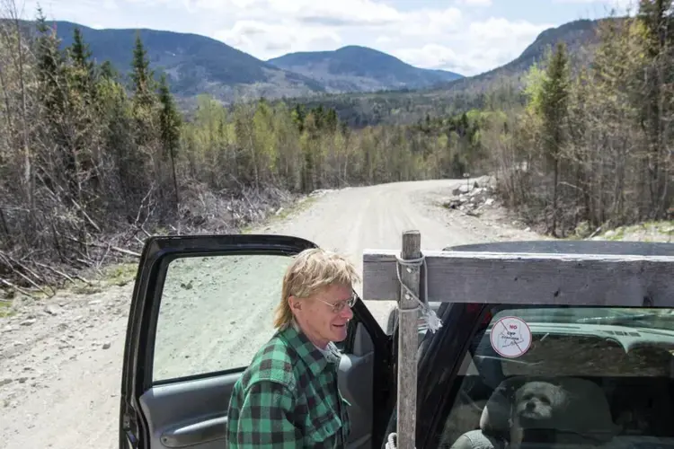 Duane Hanson hops in to his truck on Spencer Road in the Unorganized Territories in the north woods of Maine near T5 R7 on May 27, 2019. The proposed power line corridor will pass across the road at this location. Image by Michael G. Seamans. United States, 2019.