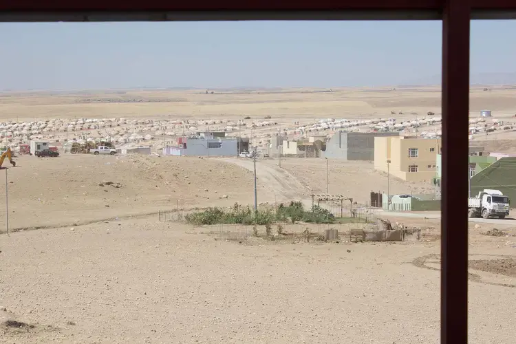 One of many camps for internally displaced people in Iraq. Forced to flee their homes when ISIS advanced on their villages in 2014, most Yazidis from the Sinjar region of Iraq remain in camps. Image by Emily Feldman. Iraq, 2015.