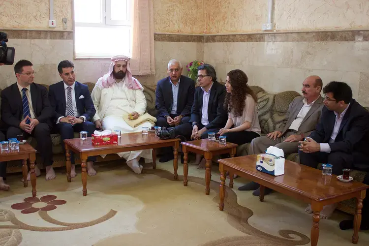 Dr. Michael Blume (left), Professor Jan Ilhan Kizilhan (third from right) and Mirza Dinnayi (right) meet with officials and Yazidi religious leaders in Lalish, Iraq. Image by Emily Feldman. Iraq, 2015.