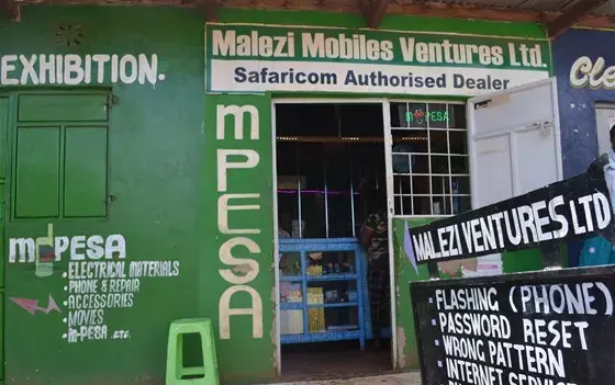 Technology business where people in the community can handle m-pesa transactions and other tech needs in Kenya. Image by Janelle Richards. Kenya, 2017.