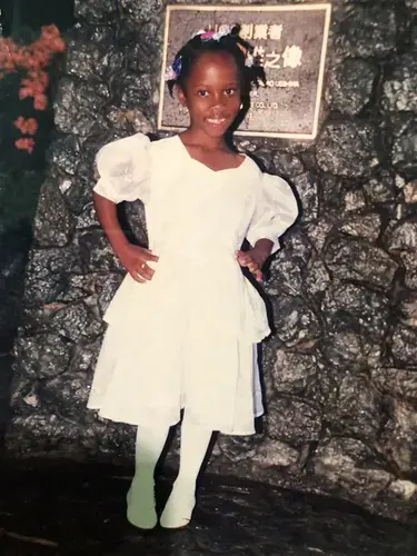 Monique Campbell at her kindergarten graduation in Jamaica. She made the short film Missing Melodie about migrating to the U.S. and the difficulty in her family reunion not being what she expected. Courtesy Monique Campbell.<br />