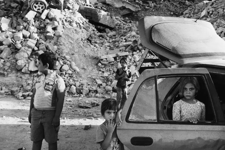 The Abdullah family fled Mosul during the battle, which was the most intense urban combat since the Second World War. They returned to find their home destroyed. Image by Moises Saman / Magnum for The New Yorker. Iraq, 2018.