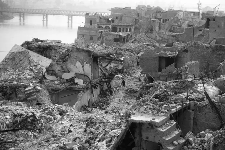 A year and a half after the battle, Mosul’s Old City is still in ruins, and unexploded bombs regularly kill people. Ten million tons of rubble remain. Image by Moises Saman / Magnum for The New Yorker. Iraq, 2018.