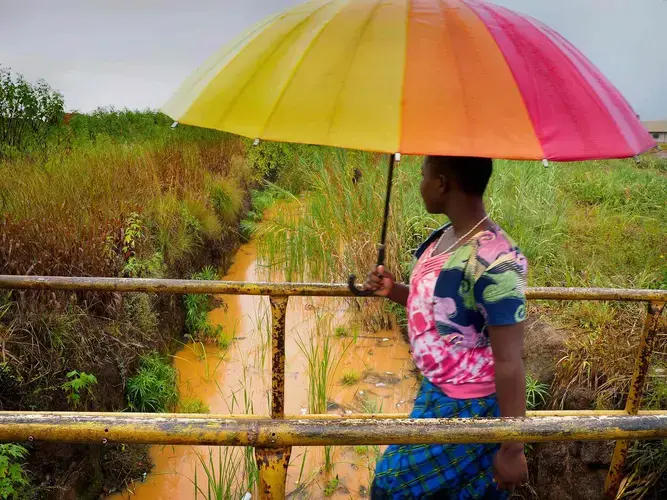 A canal drains the huge spoil heaps of the former mine but it often overflows during heavy seasonal rains, leaving nearby homes heavily contaminated. Photographer Larry Price is supported by the Pulitzer Center on Crisis Reporting.