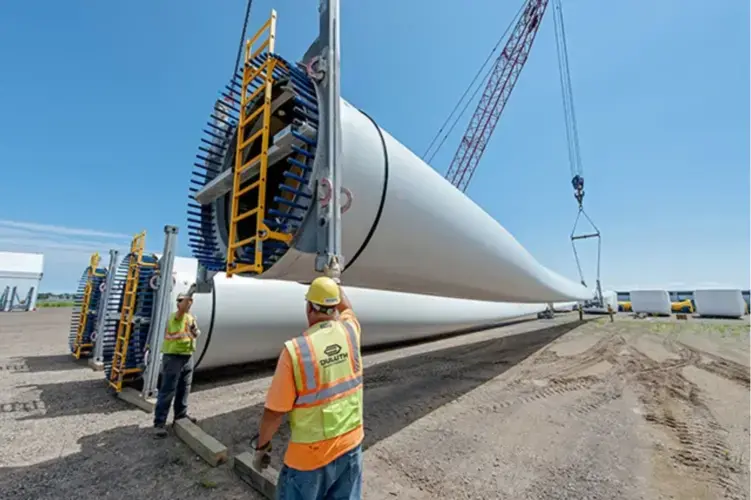 Workers at the Port of Duluth-Superior handle wind turbine parts. Port officials say they expect wind cargo to be a growing business. Image courtesy of the Duluth Seaway Port Authority. United States, undated.