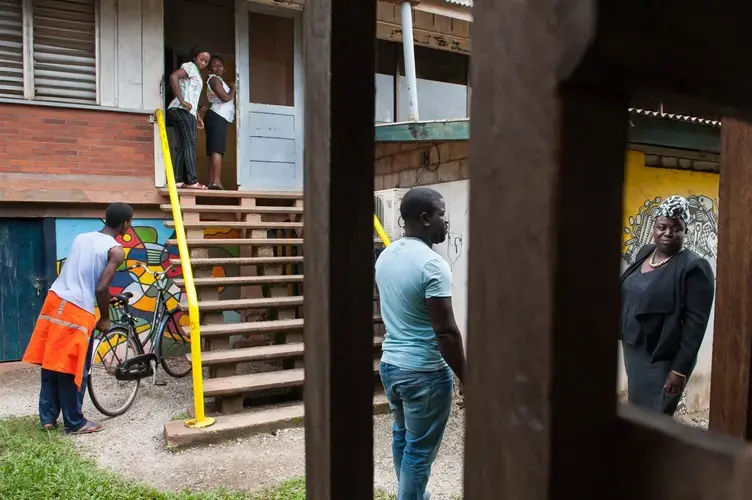 Outside of Tembe Art in the bauxite mining town of Moengo, Suriname, where Alcoa helped locally born artist Marcel Pinas to turn the company-built hospital into a cultural center and arts incubator. Image by Stephanie Strasburg. Suriname, 2017.