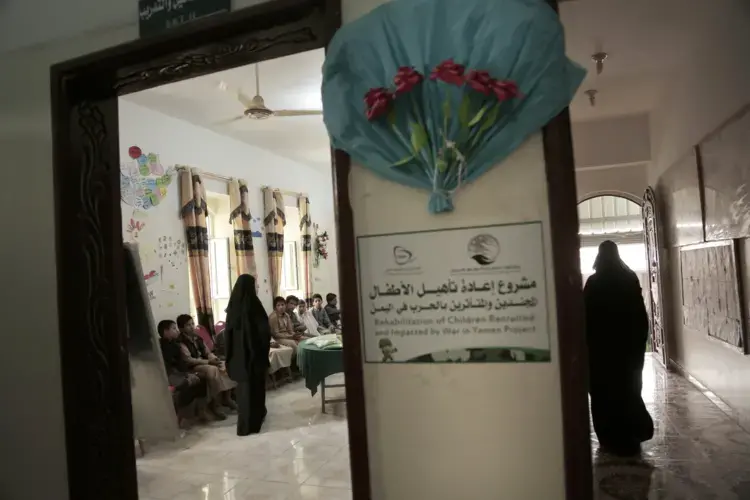 Boys listen during an Arabic language class at a rehabilitation center for former child soldiers in Marib, Yemen, in this July 28, 2018, photo. Nearly 200 former child soldiers have come through the Saudi-funded center, where they try to learn how to deal with the traumas and horrors they saw in combat. Many suffer from aggressive behavior and panic attacks. Image by Nariman El-Mofty / AP News. Yemen, 2018.