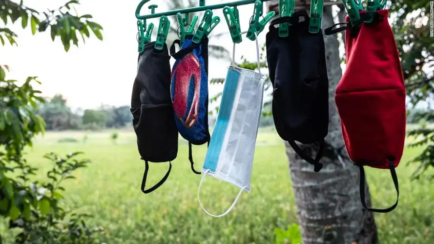 April Abrias' facemasks are hung out to dry after being washed so they can be reused. Image by Xyza Cruz Bacani. Philippines, 2020.