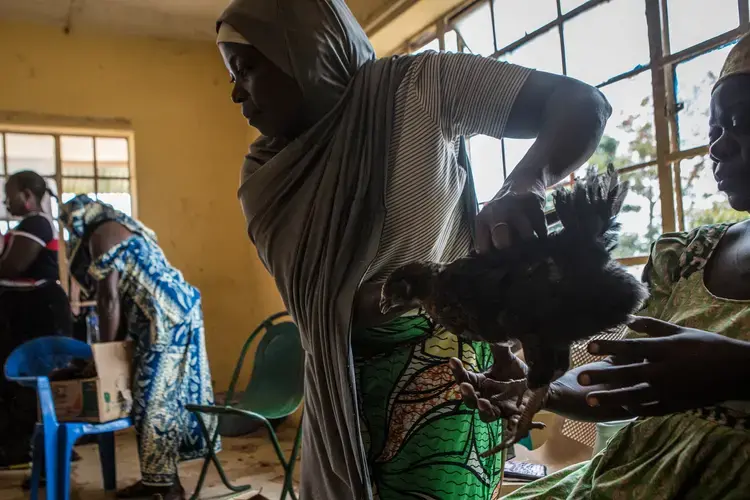 Vigilantes in Barkin Ladi spent hours mediating the dispute in the group Women for Women. Image by Jane Hahn. Nigeria, 2018.