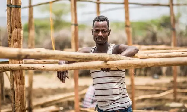 Yusuf Mohammed, a construction worker, is angry about the new railway. Image by Charlie Rosser. Ethiopia, 2018.