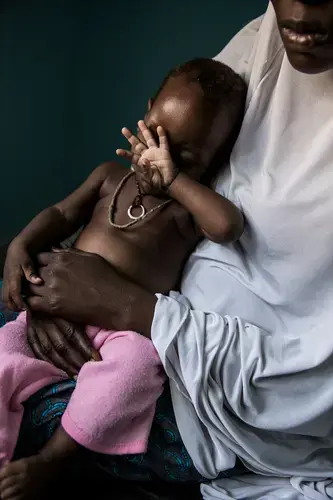 Aisha, who is in her late teens, escaped from Boko Haram while pregnant with the child of a man who raped her in the bush. She returned home briefly to Maiduguri, but left before her family could find out she was pregnant. Image by Glenna Gordon. Nigeria, 2017.