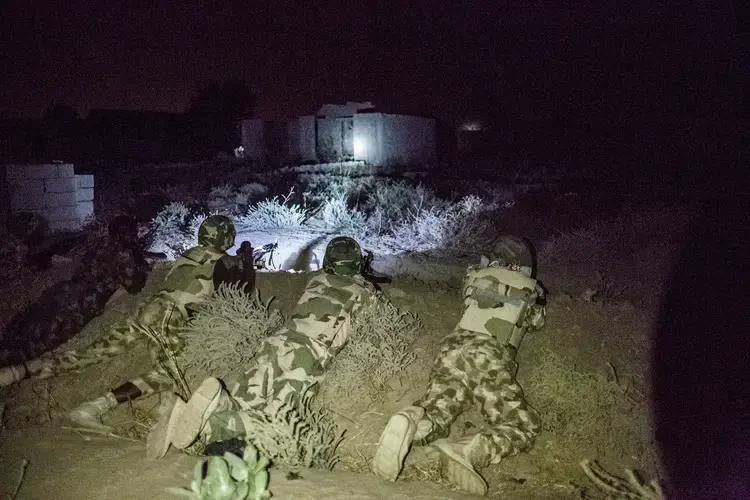 Soldiers on patrol after a suicide-bombing attempt. Image by Glenna Gordon. Nigeria, 2017.