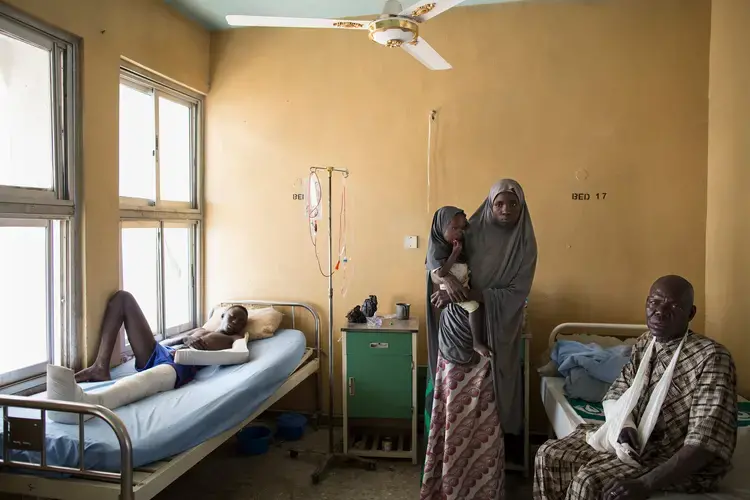 Makinta Dima, left, and Modu Dule, right, were shot by Boko Haram during a 30-minute attack on the Maiduguri-to-Damboa convoy that left more than 12 people dead. Image by Glenna Gordon. Nigeria, 2017.