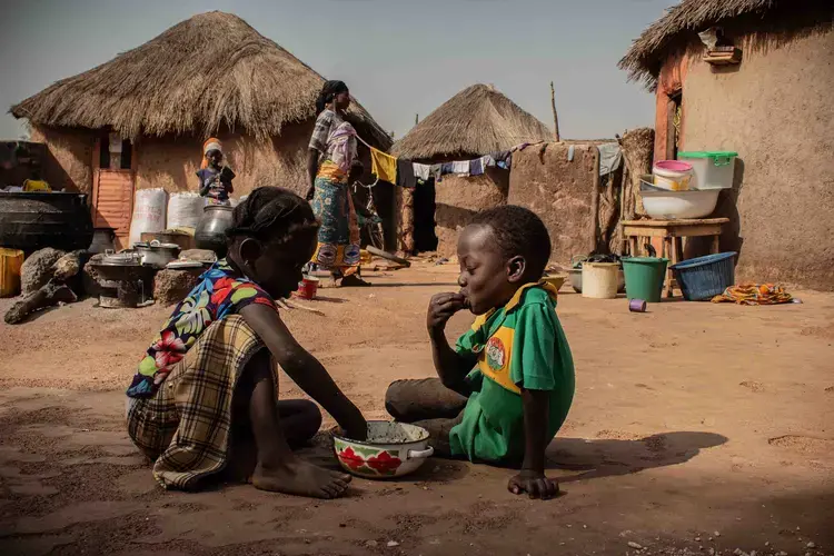 Children in Alimatu Alidu’s household, shown here, enjoy a dish made from cowpea. Image by Ankur Paliwal. Ghana, 2019.