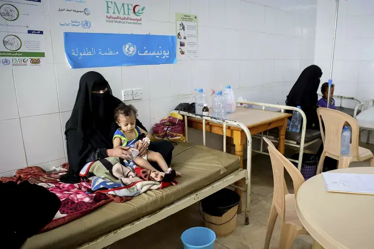 In this Sept. 16, 2017 photo released by UNICEF, children receive treatment for cholera at a hospital in Saada, Yemen. An Associated Press investigation finds that Yemen’s massive cholera epidemic was aggravated by corruption and official intransigence. The investigation has found that both the Iranian-backed Houthis rebels and their main adversary in the war—the U.S—and Saudi-backed government that controls southern Yemen— impeded efforts by relief groups to stem the epidemic. Image courtesy of UNICEF via AP. Yemen, 2017.
