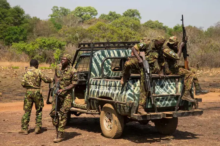 Rangers arrive at Chinko’s shooting range to practise firing a recently arrived haul of machine-guns. Image by Jack Losh. Central African Republic, 2018.