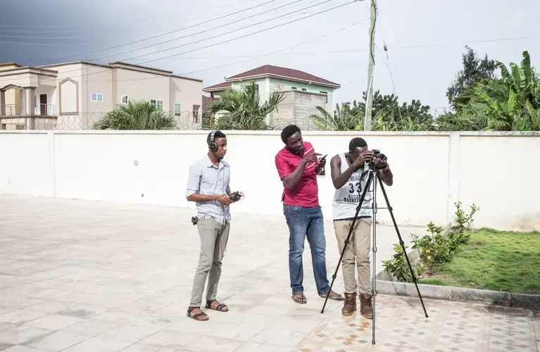 There are very few openly atheist people in Ghana. Here are three of them recording a video. Image by Tomaso Claravino. Ghana, 2018.
