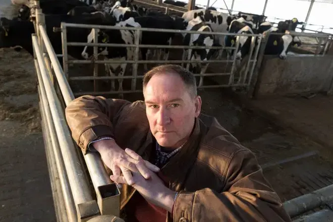 Dairy farmer Randy Roecker has battled chronic depression brought on by the stresses of farming. Image by Mark Hoffman. United States, 2020.