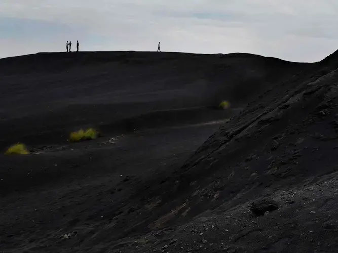 People illegally scavenge the slag heaps for scraps of lead to sell, exposing themselves to extreme levels of highly toxic lead. Image by Larry C. Price. Zambia, 2017.