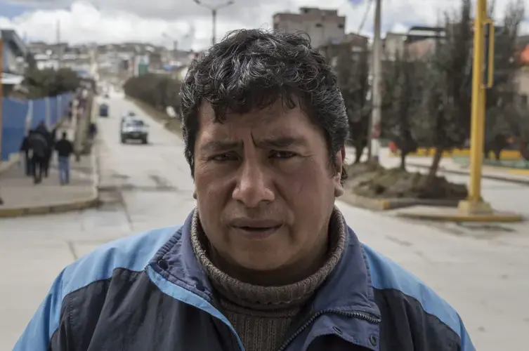 Most of Simeón Martín's family has moved from Cerro de Pasco. But he and his daughter have stayed — he works in construction and his 25-year-old daughter is married to a miner who works at Colquijirca, which is about 8 miles south of Cerro. His difficulty in moving out resembles the cases of many families PRI spoke to. Image by Ricardo Martínez. Peru, 2017.