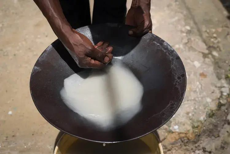 A gold miner pans for gold in Nieuw Koffiekamp, Suriname. Image by Stephanie Strasburg. Suriname, 2017.<br />