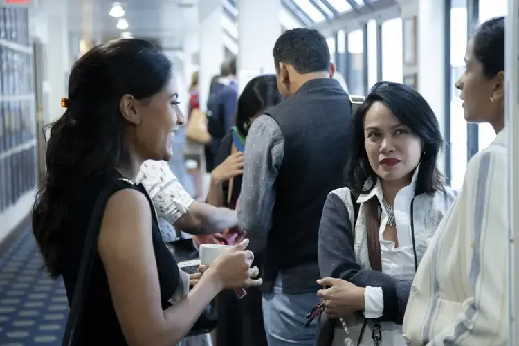 In between panels, journalist grantees Ana Santos (center) and Krithika Varagur (left) chat over coffee with journalist grantee Sushma Subramanian. Image by Jin Ding. United States, 2019.