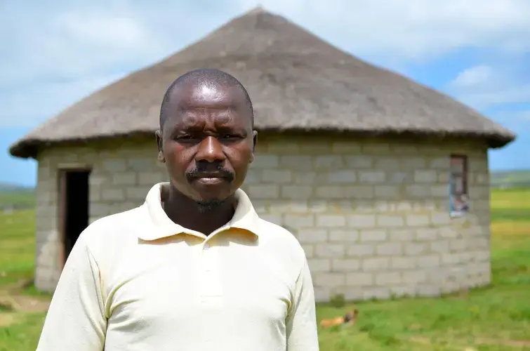 Sibhoso Divele outside his home near the proposed mine site. Image by Mark Olalde. South Africa, 2017.