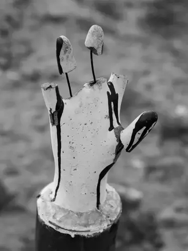 A makeshift memorial commemorating the massacre of Tamil civilians at the hands of the Sri Lankan army near the end of the war. Image by Moises Saman. Sri Lanka, 2018.