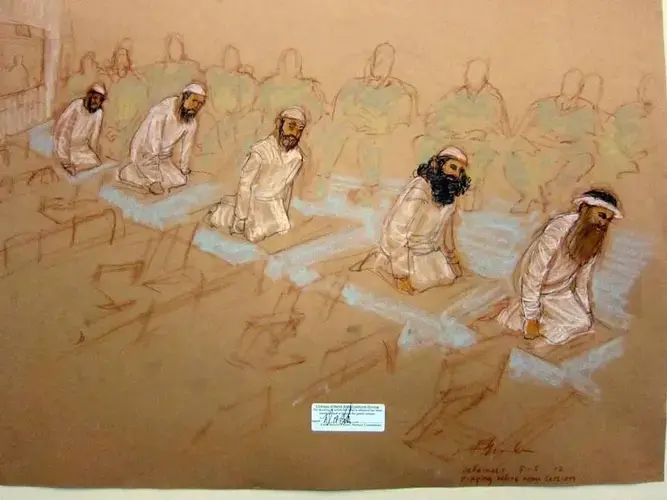 From left, Mustafa al Hawsawi, Ammar al Baluchi, Ramzi bin al Shibh, Walid bin Attash and Khalid Sheik Mohammed pray at their Guantánamo war court arraignment. This sketch was reviewed and approved for release by a U.S. military security official. Image by Janet Hamlin. Cuba, 2012.