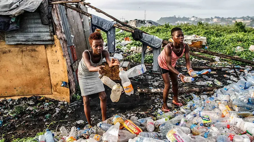Children earn their living by recycling plastic soda bottles and cans. Image by Marc Ellison/Al Jazeera. Nigeria, 2018.