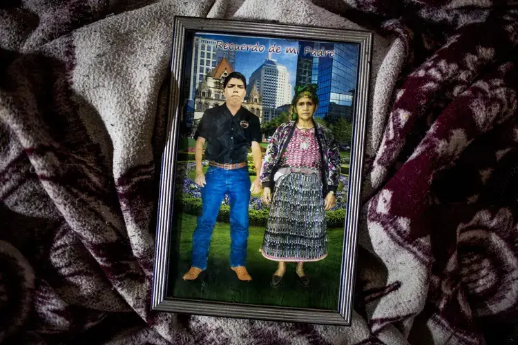This picture of Pascual Alonzo’s grandparents features a typical, idealized “American Dream” background: skyscrapers and green gardens. Image by Simone Dalmasso. Guatemala, 2019.
