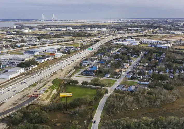 The new Interstate 26 interchange and a marsh surround the Rosemont neighborhood in Charleston on Jan. 23, 2020. Decades after I-26 sliced through the community, Rosemont faces another road project that residents say is threatening their quality of life. Image by Gavin McIntyre / The Post and Courier. United States, 2020.