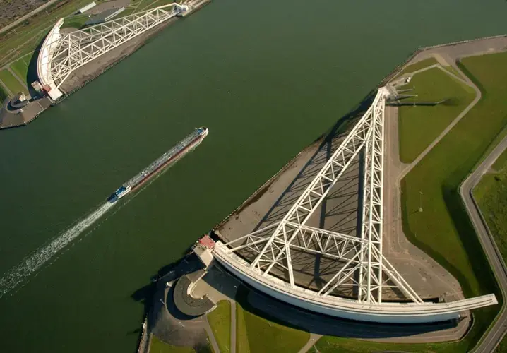 A ship passes the gates of the Maeslant storm surge barrier as it enters the New Waterway from the North Sea. The gates swing closed during storms to protect over a million people in and around Rotterdam during storm surges. Image by Michael DeMocker / NOLA.com | The Times-Picayune. Netherlands, 2019.