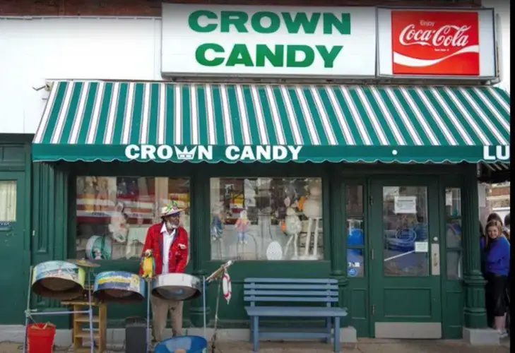 Jamaica Ray with drums outside Crown Candy. Image by Sylvester Brown / The St. Louis American. United States, 2020.