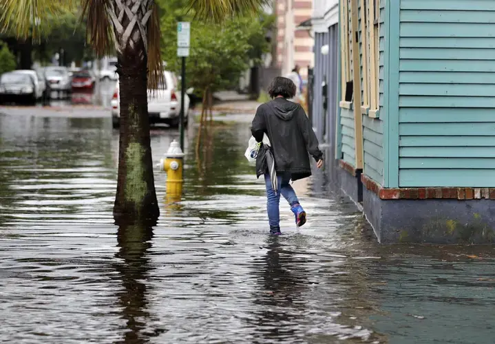 Residents of East Side are among Charleston residents who commonly deal with flooding. America Street was covered by water after several inches of rain fell, flooding parts of the peninsula on Wednesday, May 20, 2020. Image by Grace Beahm Alford / The Post and Courier. United States, 2020.