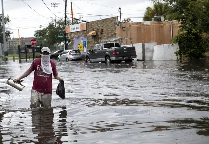 Line Street near President Street is flooded after a rainstorm on Friday, Sept. 25, 2020, in Charleston. Charleston-area floodwaters are a festering soup of disease-carrying microbes, a new Post and Courier analysis shows. Image by Andrew J. Whitaker / Post and Courier. United States, 2020.