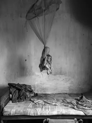 An empty room in the village of Keppapulavu, northern Sri Lanka, now abandoned by its former Tamil owners. Image by Moises Saman. Sri Lanka, 2018.