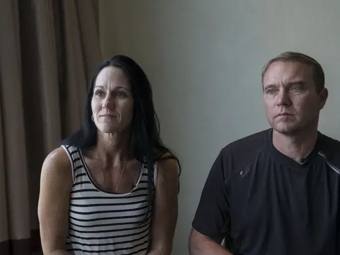 Mindie and Tom Simons, of Carroll, Iowa, give an interview before Tom's acupuncture treatment on Wednesday, Sept. 20, at the St. Regis hotel in Tianjin, China. Image by Kelsey Kremer. China, 2017.