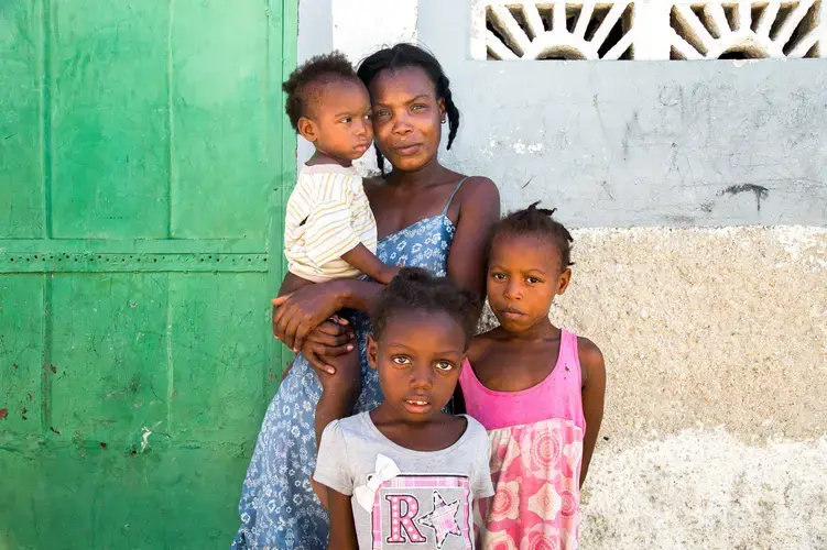 Project Drouillard resident Magdala Simeone and her neighbors recently pooled $75 to get a shared pit latrine emptied. She never met the person or people who did the work and doesn't know where the human waste was dumped. Image by Marie Arago/NPR. Haiti, 2017.