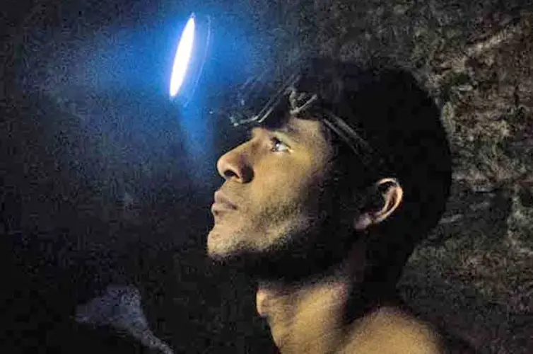 Franco León, a young miner who suffers from malaria which is common in the Mining Arc. Miners work under grueling, unhealthy, dangerous conditions for little money. Image by Bram Ebus. Venezuela, 2017.<br />