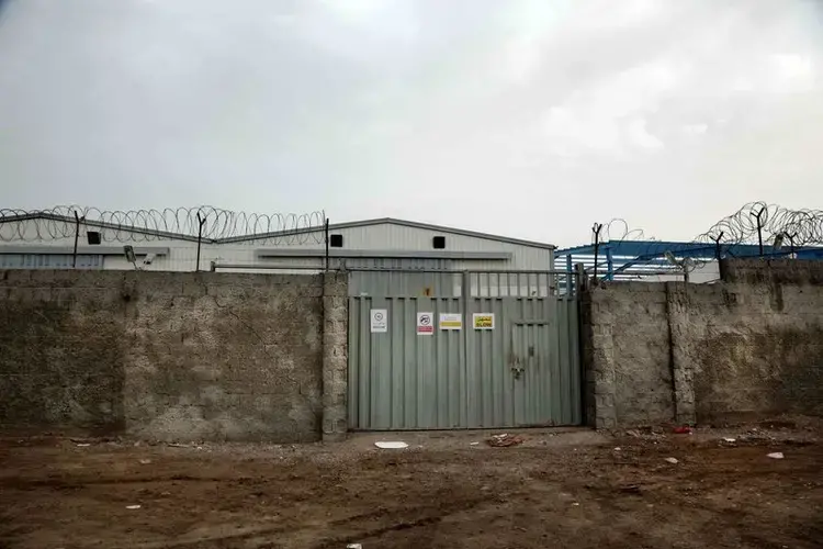 The entrance of the hangar of the United Nations in Aden. Image by Nariman El-Mofty/AP Photo. Yemen, 2018.