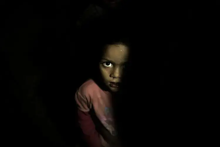 A child stands in a room at a shelter for displaced persons in Ibb. Image by Nariman El-Mofty/AP Photo. Yemen, 2018.